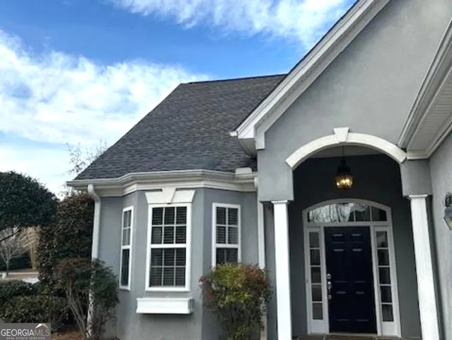 a living room with a fireplace and a wooden floor
