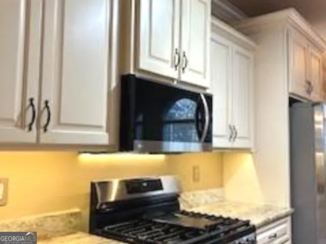 a view of a room with a window and a fan