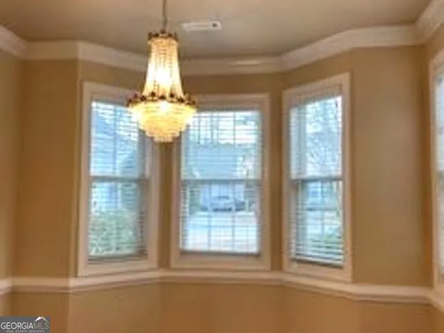 front view of a house with a garden