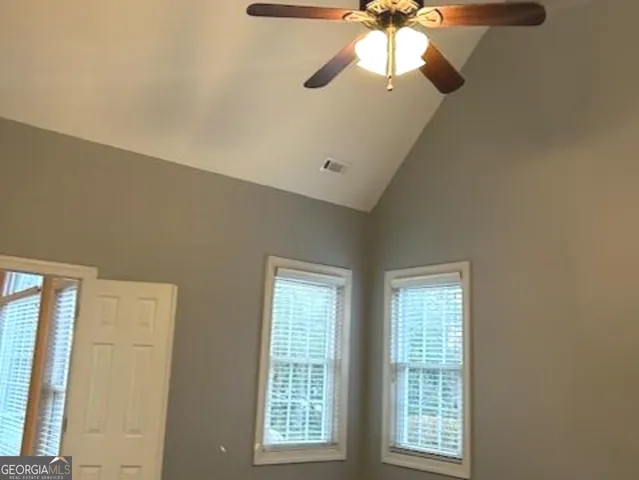 a view of a house with a tree