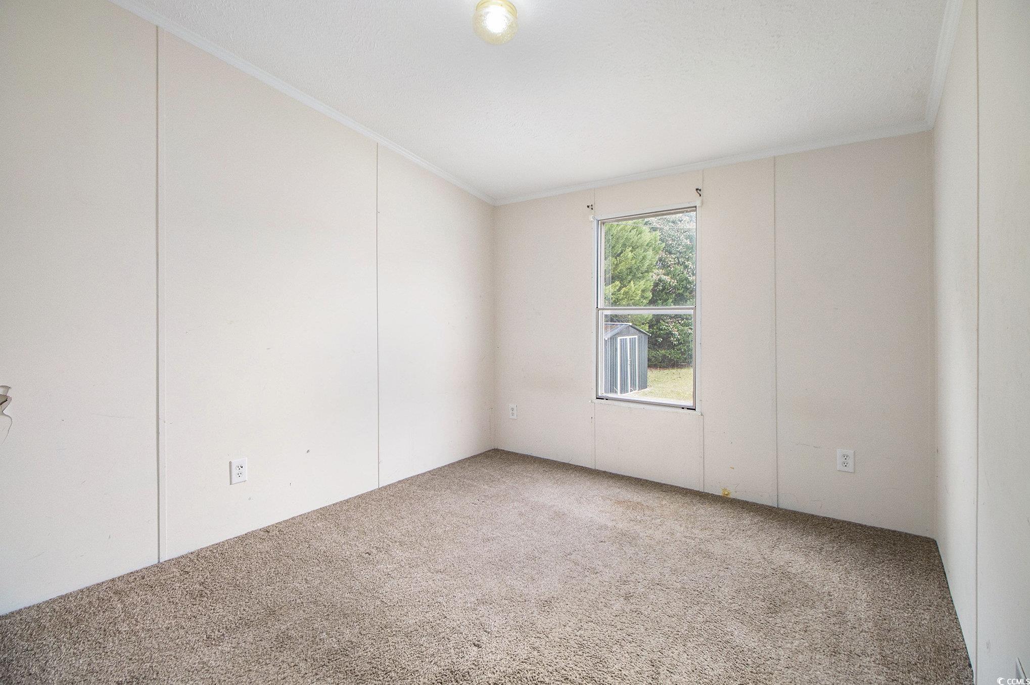 3804 Stern Drive Conway, SC 29526 - Photo 25 of 38 Carpeted empty room with crown molding