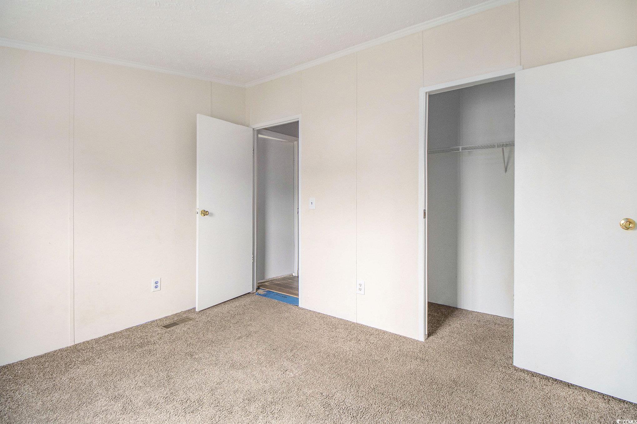 3804 Stern Drive Conway, SC 29526 - Photo 29 of 38 Unfurnished bedroom with crown molding and carpet floors