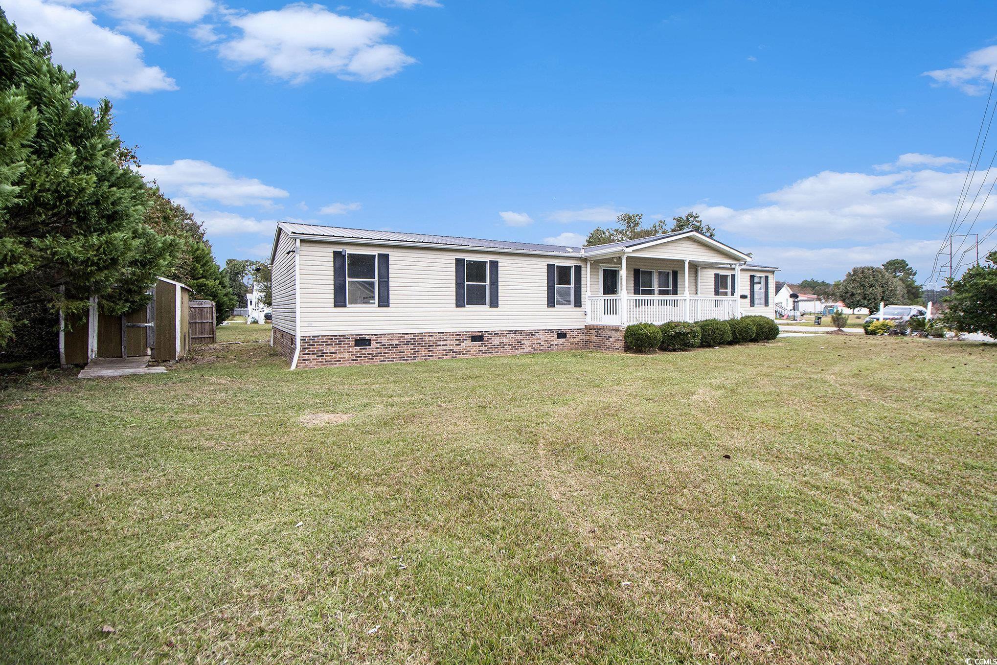 3804 Stern Drive Conway, SC 29526 - Photo 37 of 38 Manufactured / mobile home with crawl space, a front lawn, a porch, and a storage shed