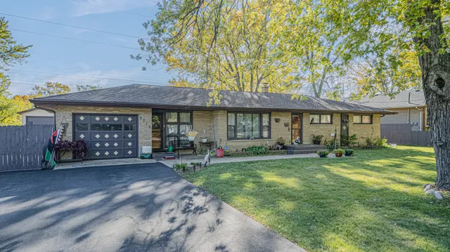 a view of a house with a yard porch and sitting area