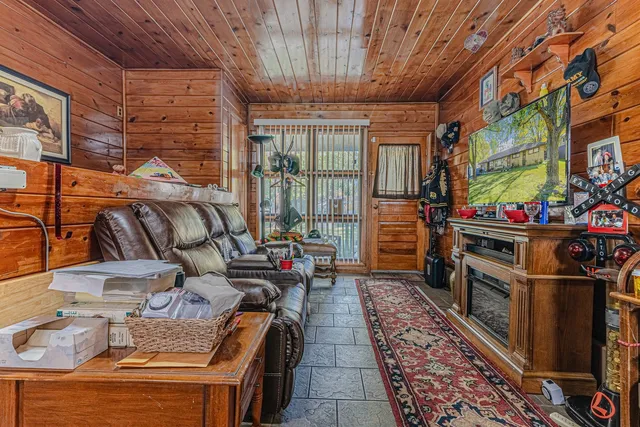 a utility room with lots of wooden furniture