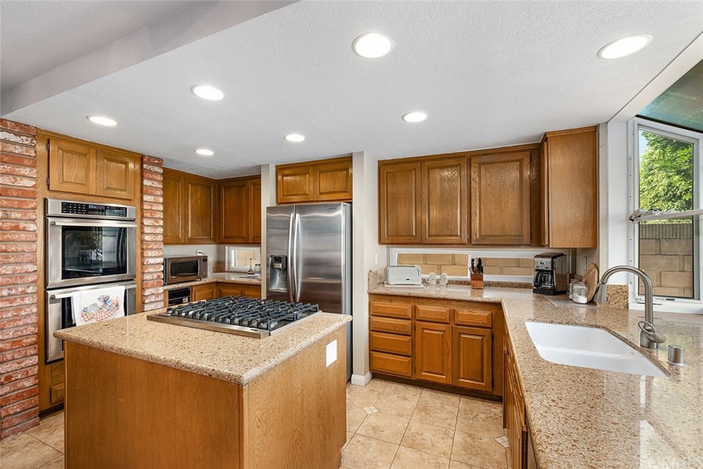 3 Descanso Irvine, CA 92620 - Photo 14 of 54 a kitchen with a sink stove and refrigerator