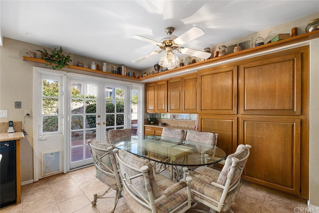 3 Descanso Irvine, CA 92620 - Photo 16 of 54 a dining room with furniture a chandelier and window