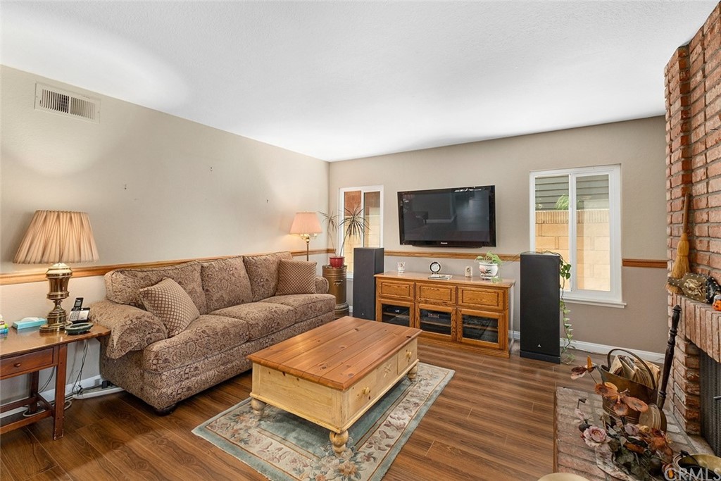 3 Descanso Irvine, CA 92620 - Photo 19 of 54 a living room with furniture and a flat screen tv