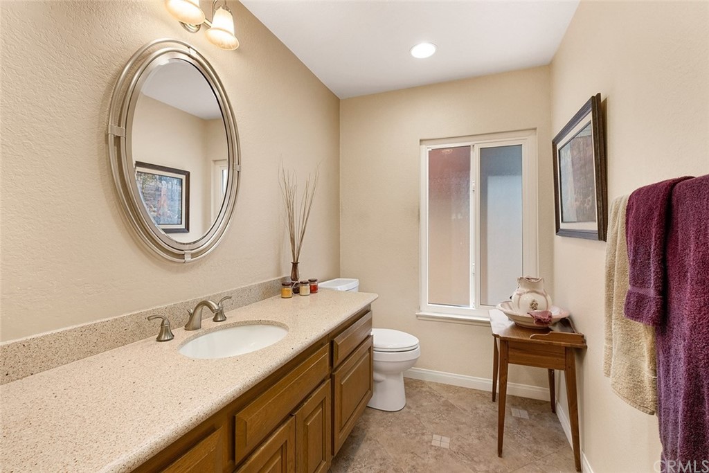3 Descanso Irvine, CA 92620 - Photo 20 of 54 a bathroom with a sink and a mirror