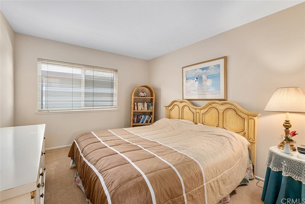 3 Descanso Irvine, CA 92620 - Photo 30 of 54 a bedroom with a bed and a lamp with window