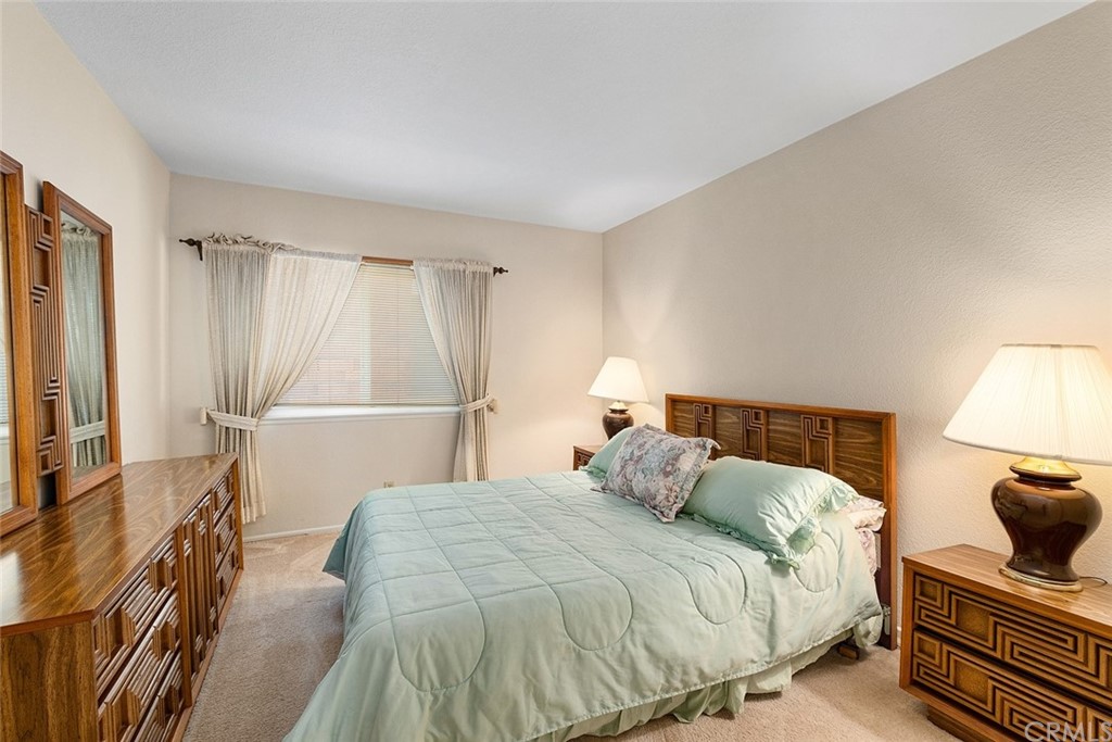 3 Descanso Irvine, CA 92620 - Photo 32 of 54 a bedroom with a bed and wooden floor