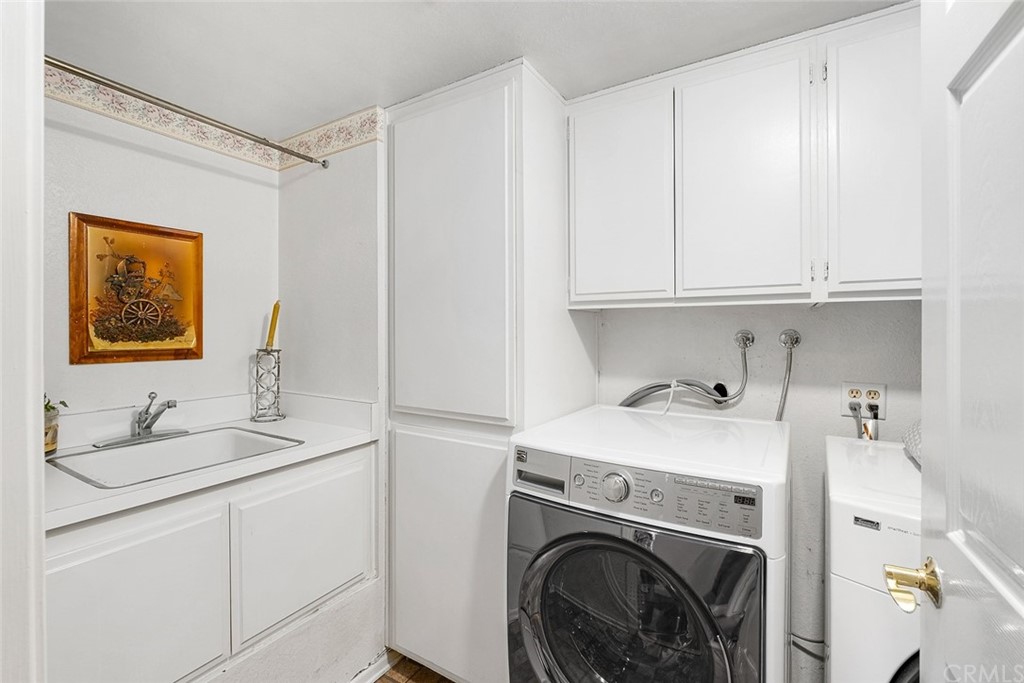 3 Descanso Irvine, CA 92620 - Photo 33 of 54 a utility room with sink dryer and washer