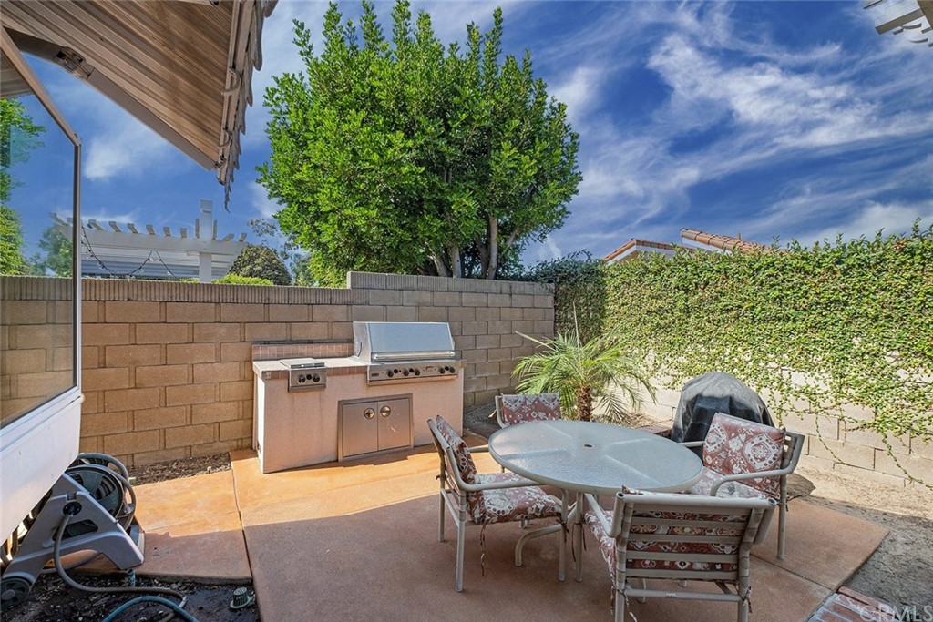 3 Descanso Irvine, CA 92620 - Photo 35 of 54 a backyard of a house with table and chairs