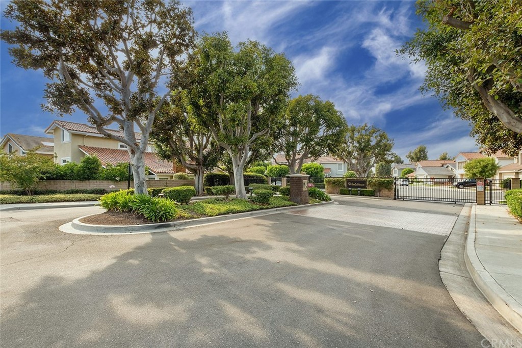 3 Descanso Irvine, CA 92620 - Photo 40 of 54 a view of city street with a building and trees in the background