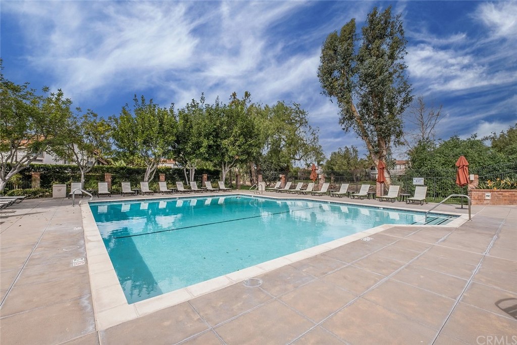 3 Descanso Irvine, CA 92620 - Photo 43 of 54 a view of a swimming pool with a yard and a fountain