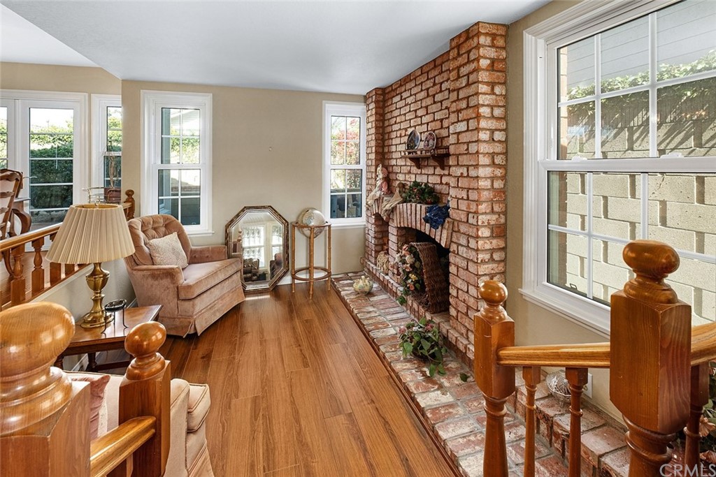 3 Descanso Irvine, CA 92620 - Photo 9 of 54 a living room with furniture fireplace and wooden floor