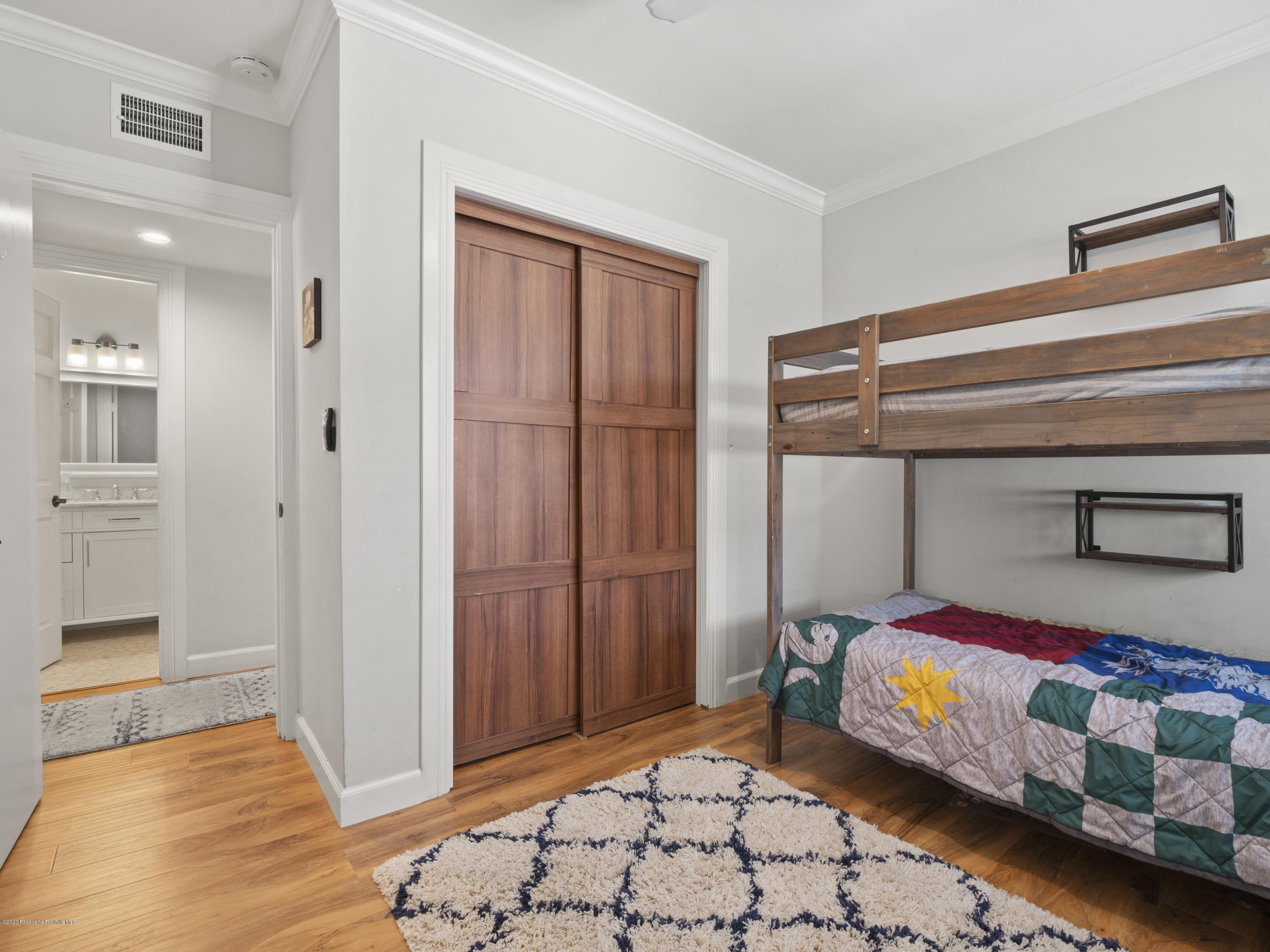 4191 Aralia Road Altadena, CA 91001 - Photo 11 of 26 a bedroom with a bed and a window
