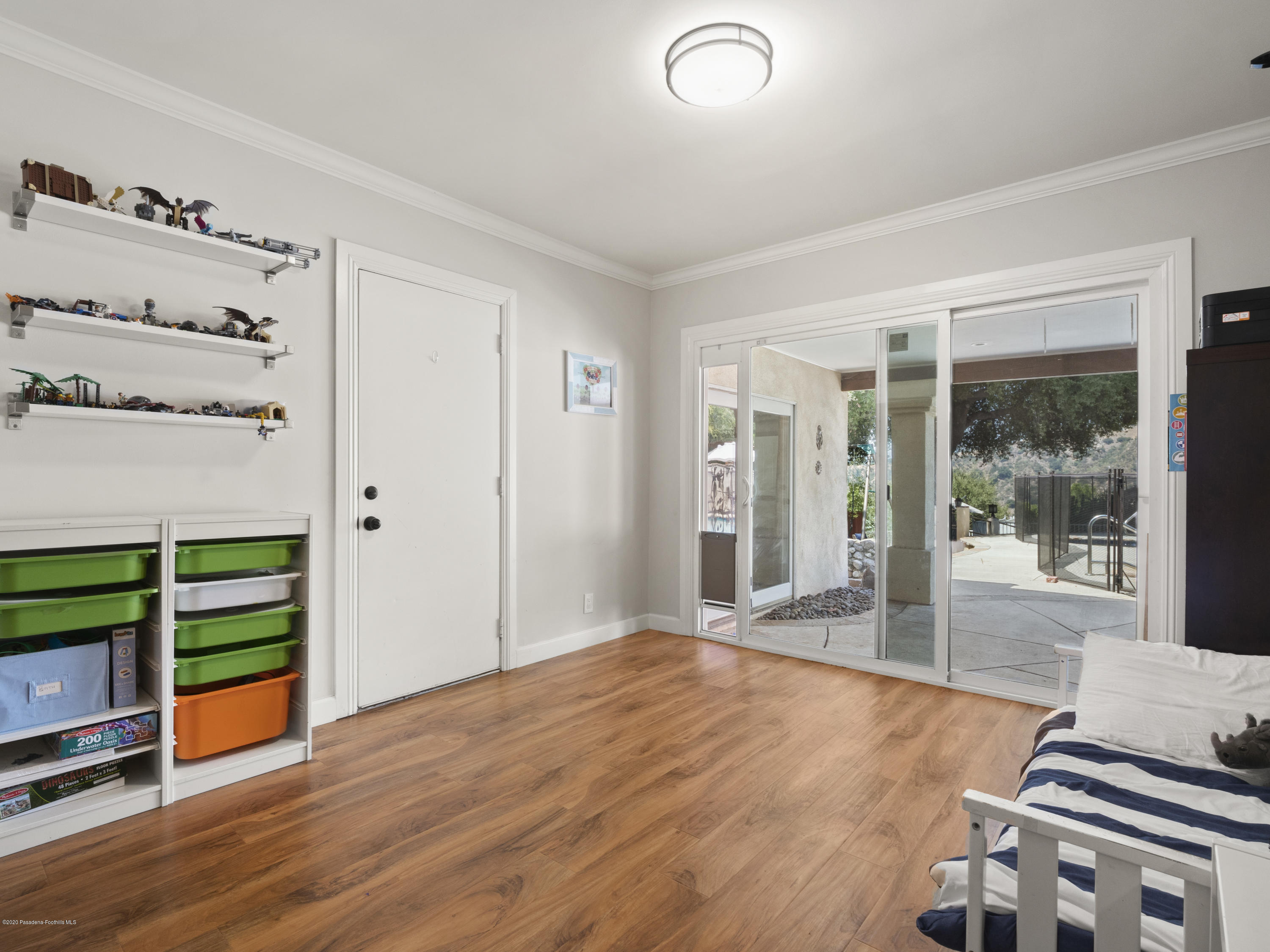 4191 Aralia Road Altadena, CA 91001 - Photo 13 of 26 a room with wooden floor and furniture
