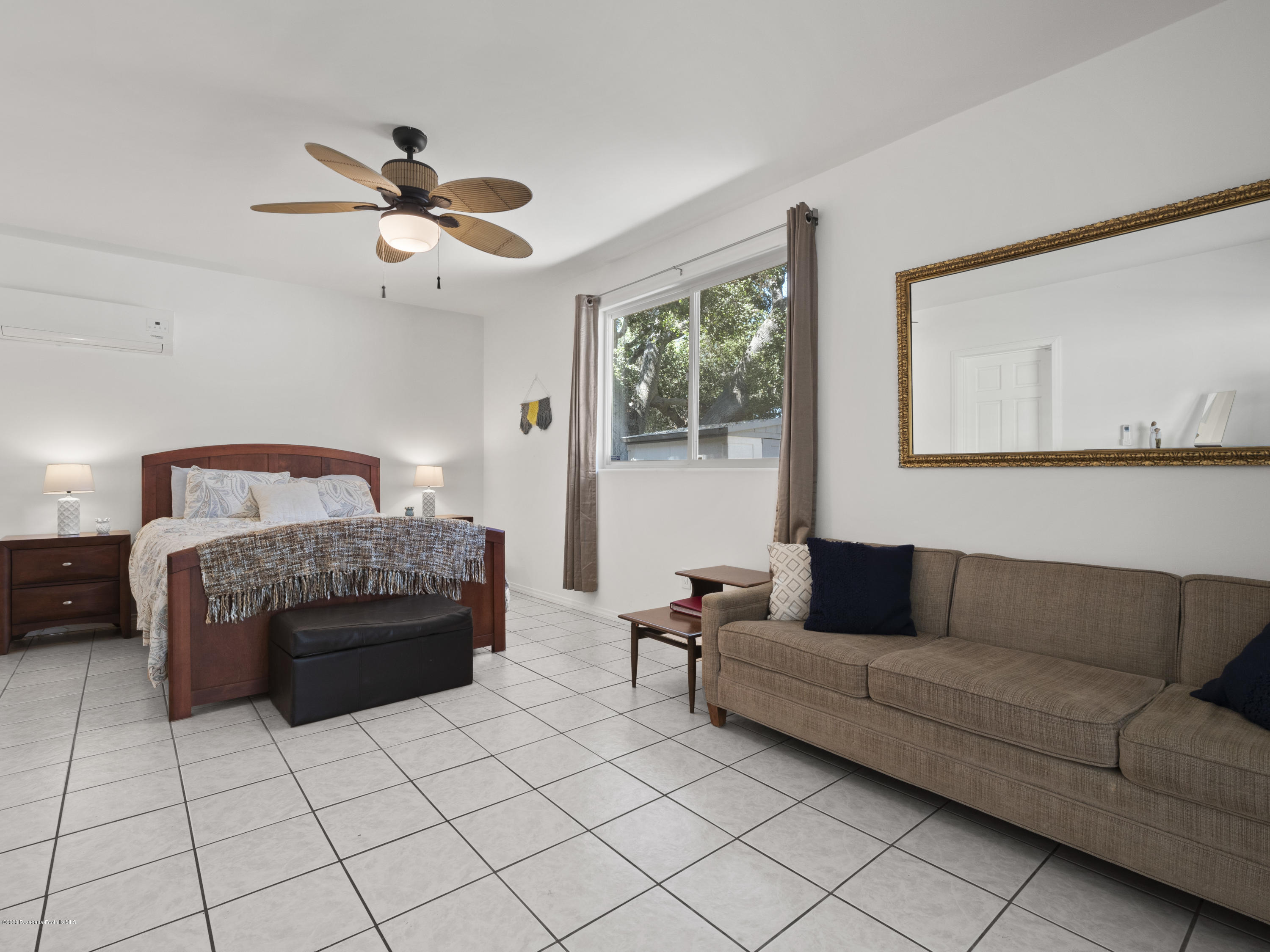 4191 Aralia Road Altadena, CA 91001 - Photo 19 of 26 a living room with furniture and a large window