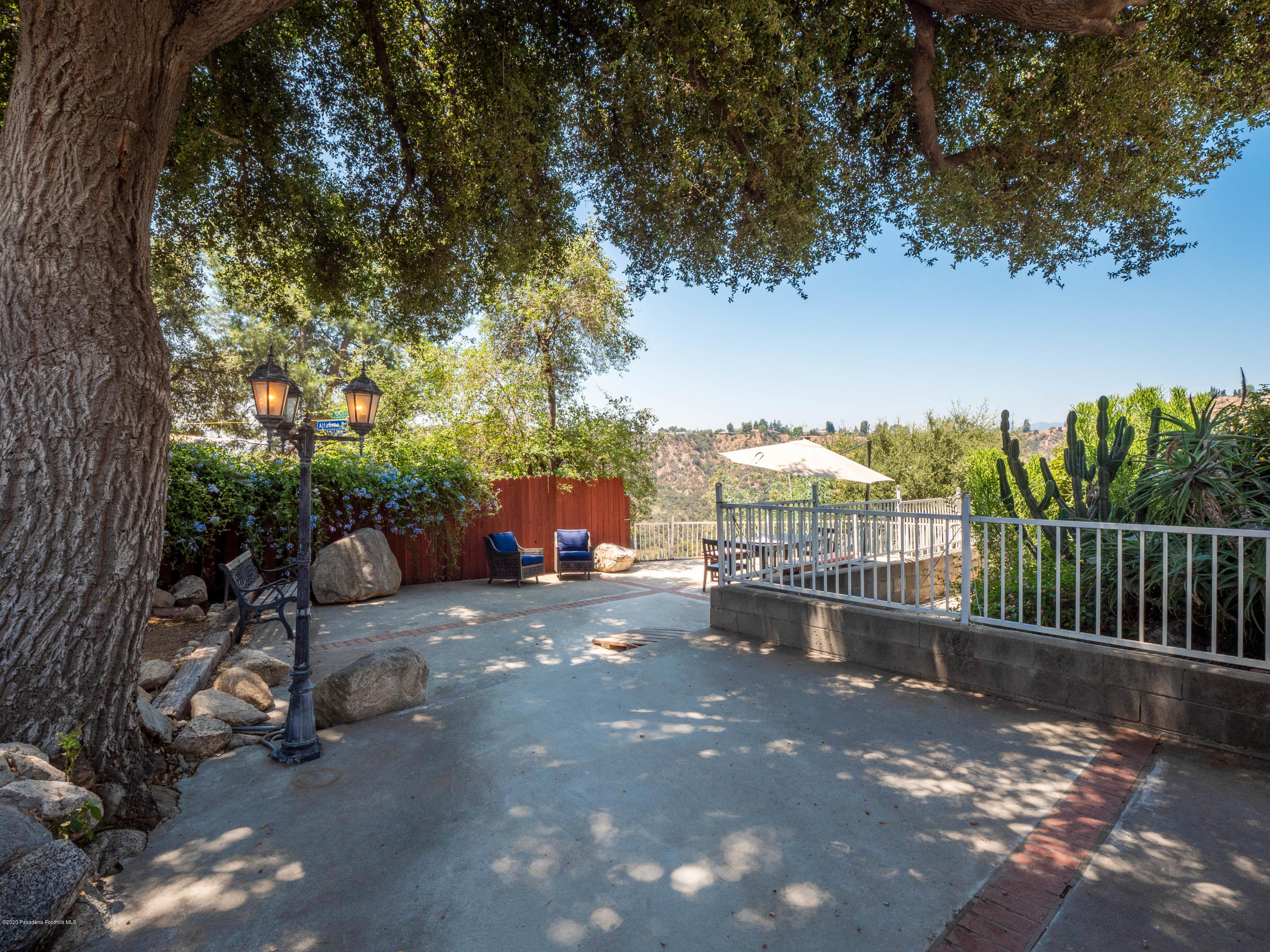 4191 Aralia Road Altadena, CA 91001 - Photo 20 of 26 a view of a patio and fire pit