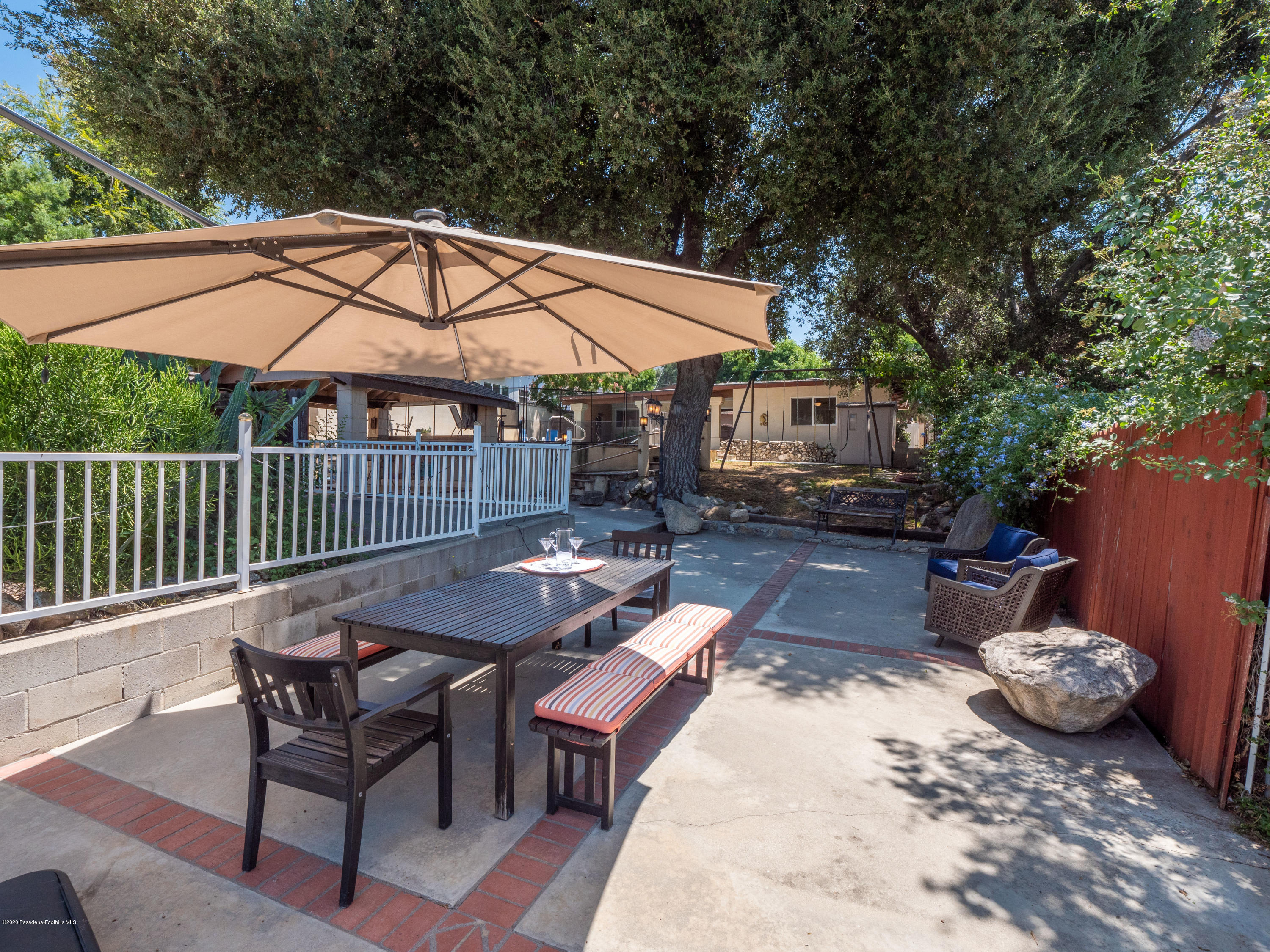 4191 Aralia Road Altadena, CA 91001 - Photo 21 of 26 a backyard of a house with table and chairs