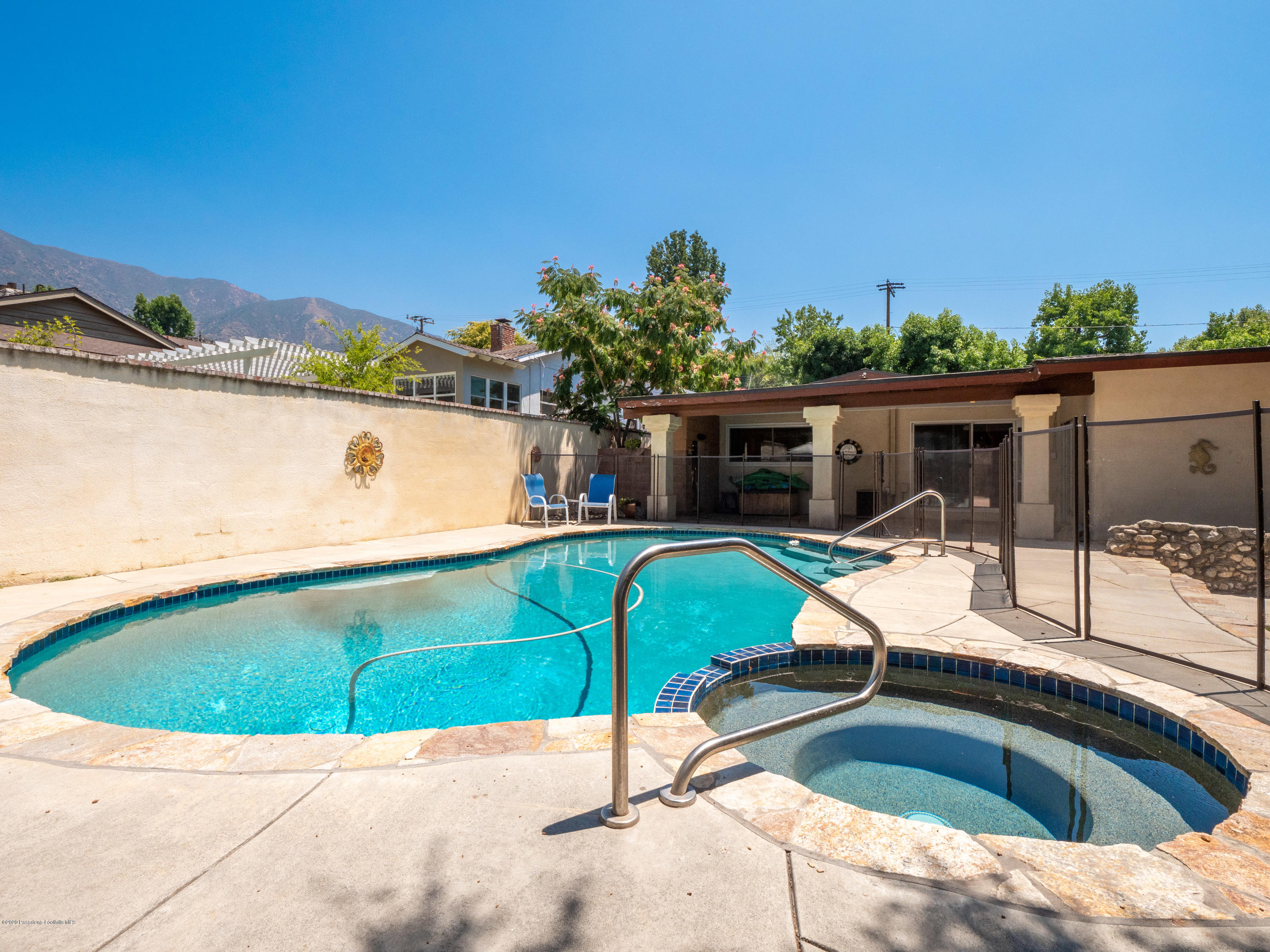 4191 Aralia Road Altadena, CA 91001 - Photo 22 of 26 a view of a swimming pool with a patio