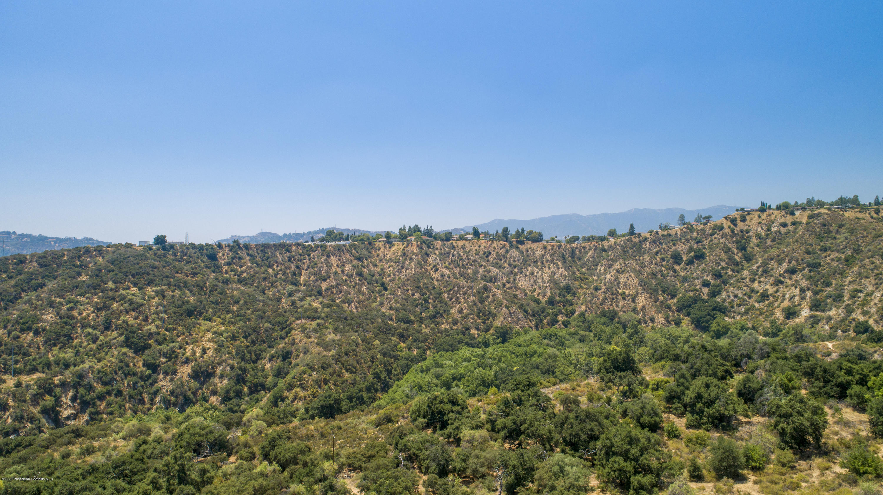 4191 Aralia Road Altadena, CA 91001 - Photo 26 of 26 a view of a large building with a mountain in the background