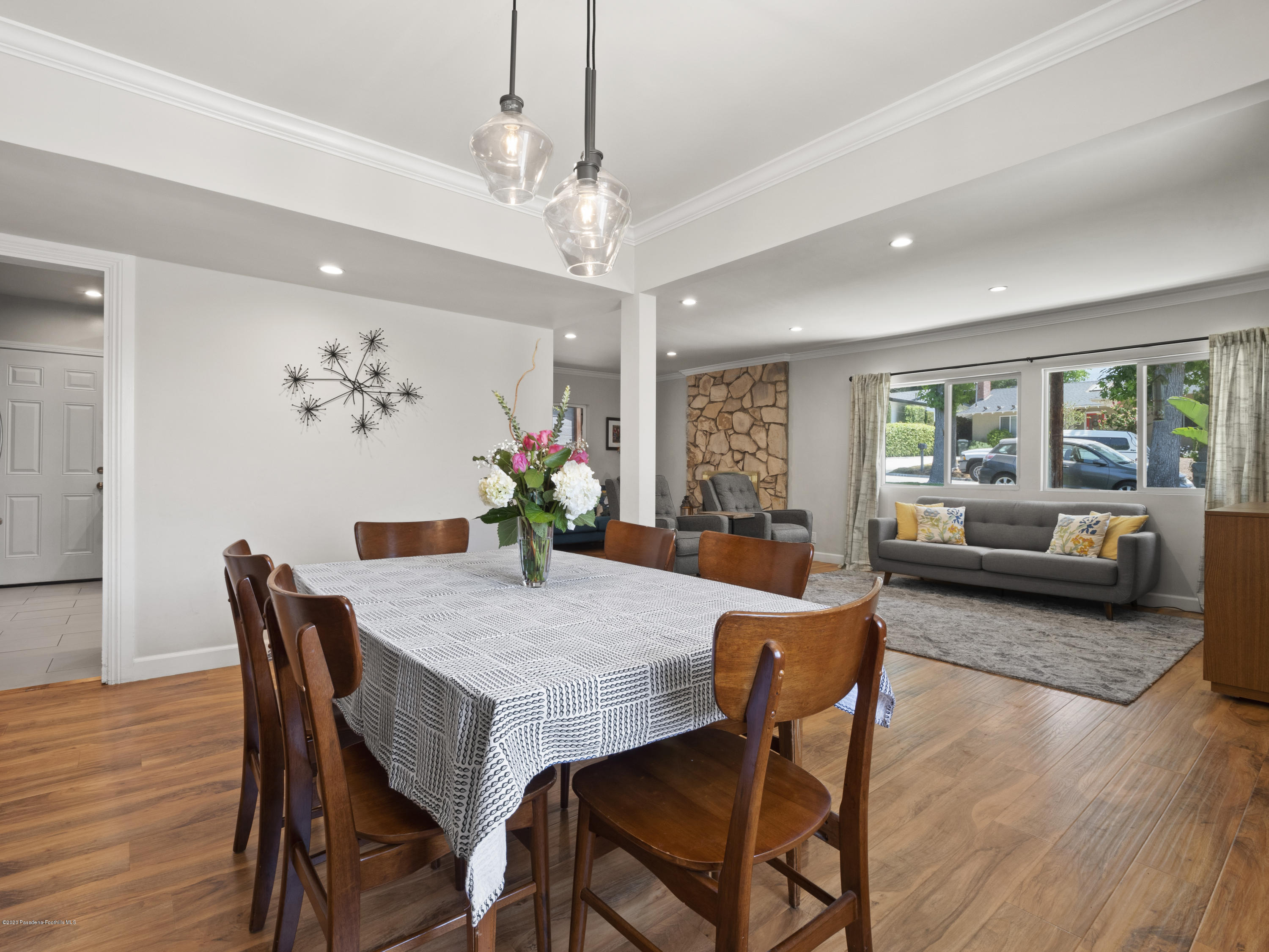 4191 Aralia Road Altadena, CA 91001 - Photo 4 of 26 a view of a dining room with furniture a livingroom and wooden floor