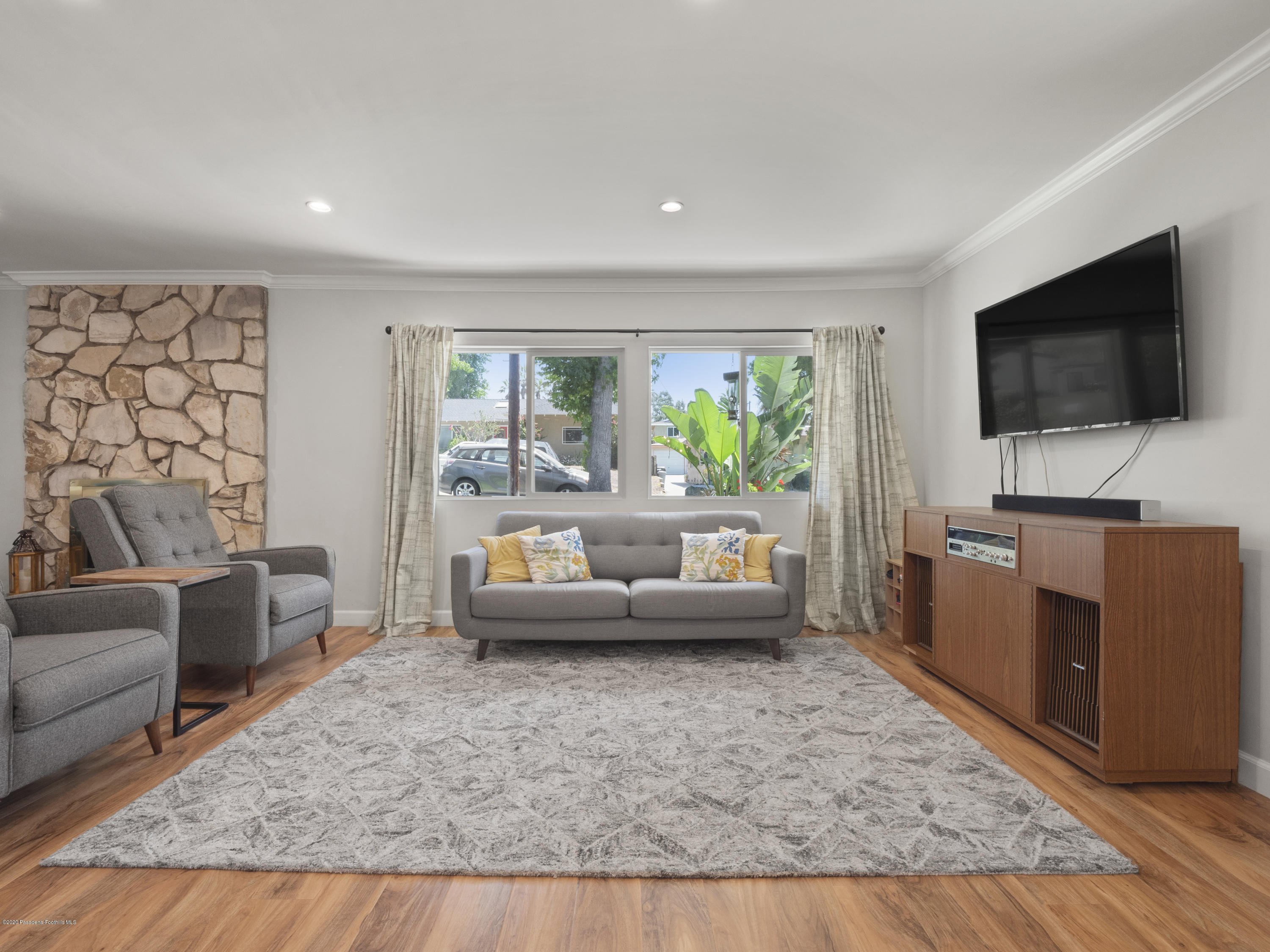 4191 Aralia Road Altadena, CA 91001 - Photo 6 of 26 a living room with furniture and a flat screen tv