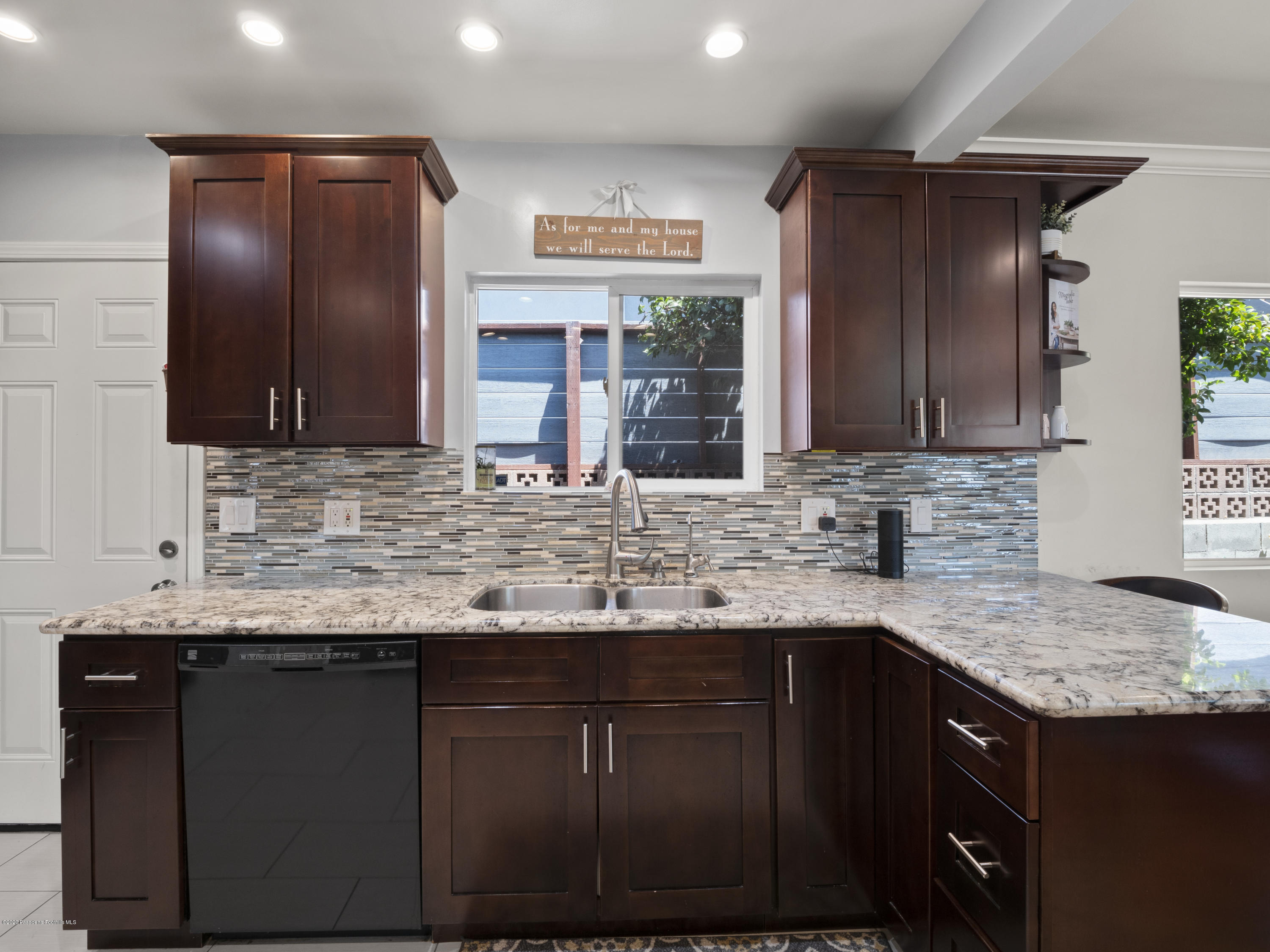 4191 Aralia Road Altadena, CA 91001 - Photo 8 of 26 a kitchen with granite countertop stainless steel appliances a sink stove and cabinets