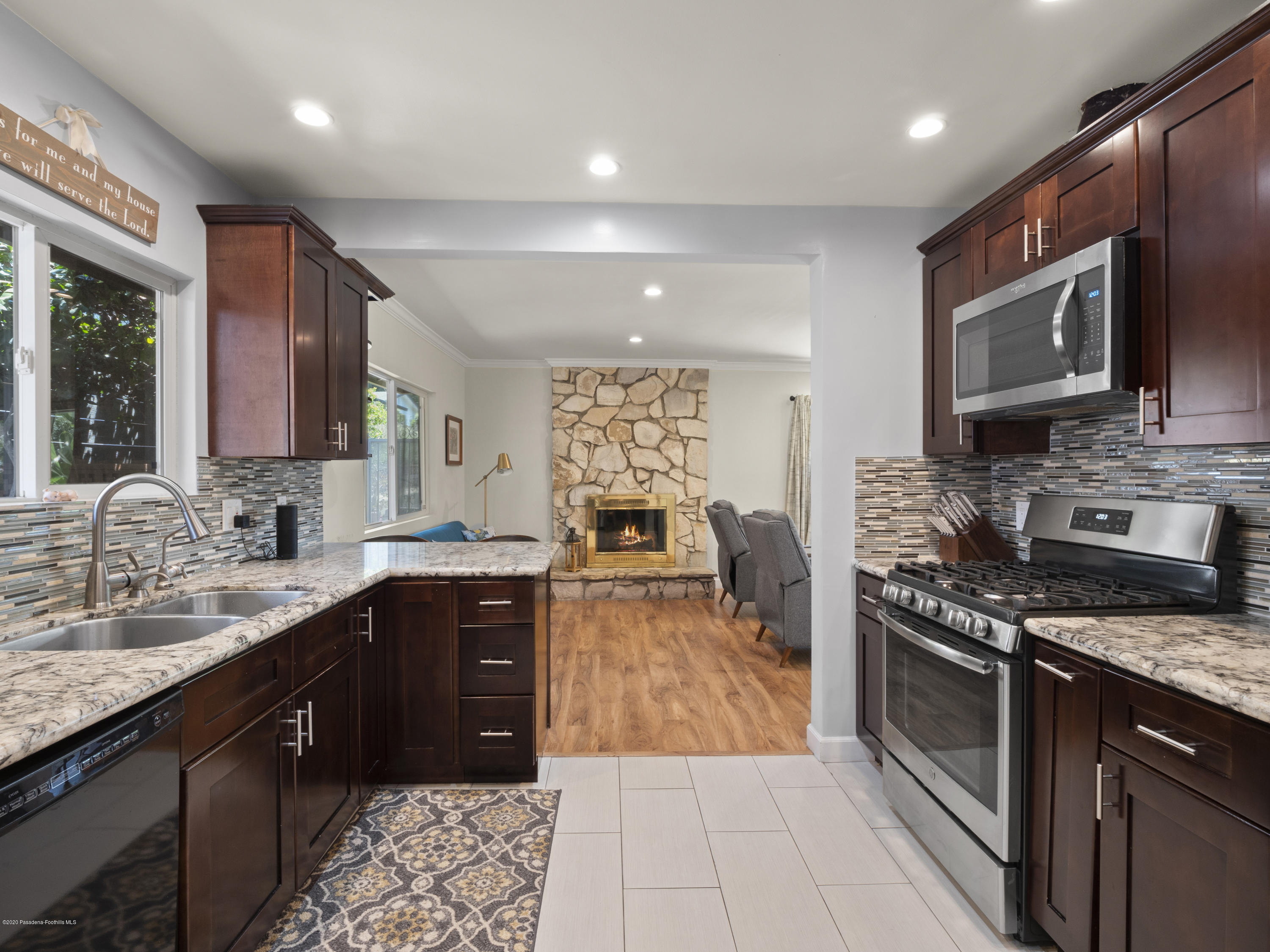 4191 Aralia Road Altadena, CA 91001 - Photo 9 of 26 a large kitchen with stainless steel appliances granite countertop a stove sink and cabinets