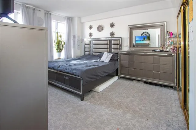 a bedroom with a bed and a cabinets