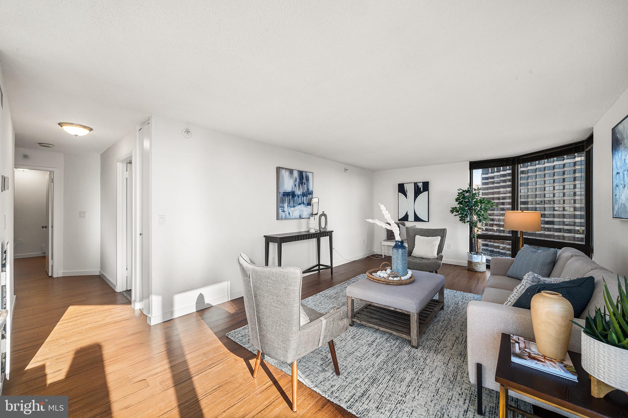 2018 Walnut Street, Unit 16E Philadelphia, PA 19103 - Photo 17 of 35 a living room with furniture and wooden floor
