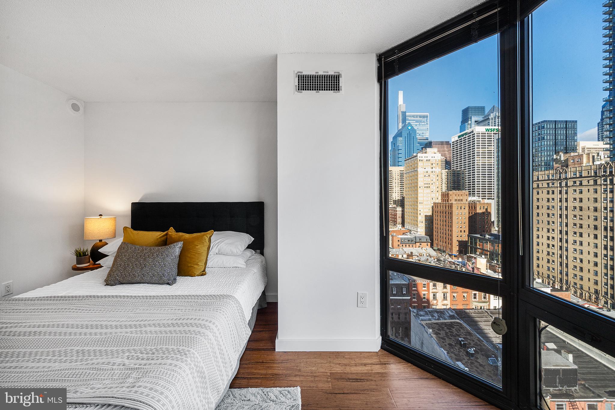 2018 Walnut Street, Unit 16E Philadelphia, PA 19103 - Photo 20 of 35 a bedroom with a bed and window