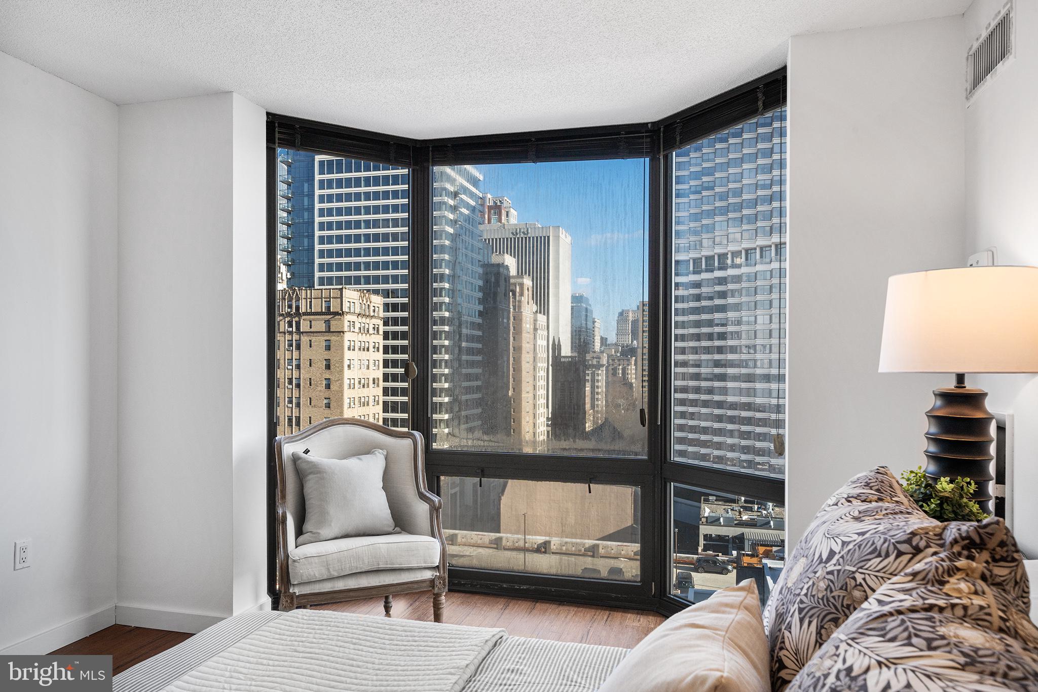 2018 Walnut Street, Unit 16E Philadelphia, PA 19103 - Photo 25 of 35 a living room with furniture and a large window
