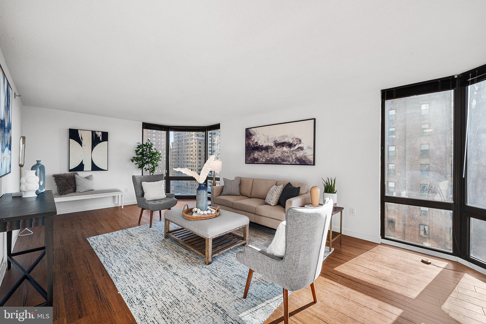 2018 Walnut Street, Unit 16E Philadelphia, PA 19103 - Photo 3 of 35 a living room with furniture and a window