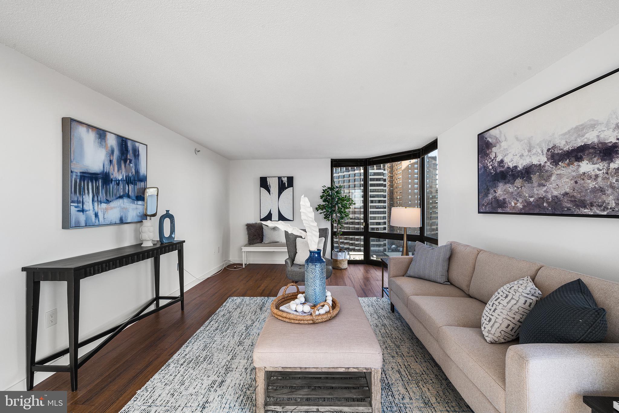 2018 Walnut Street, Unit 16E Philadelphia, PA 19103 - Photo 5 of 35 a living room with furniture and wooden floor