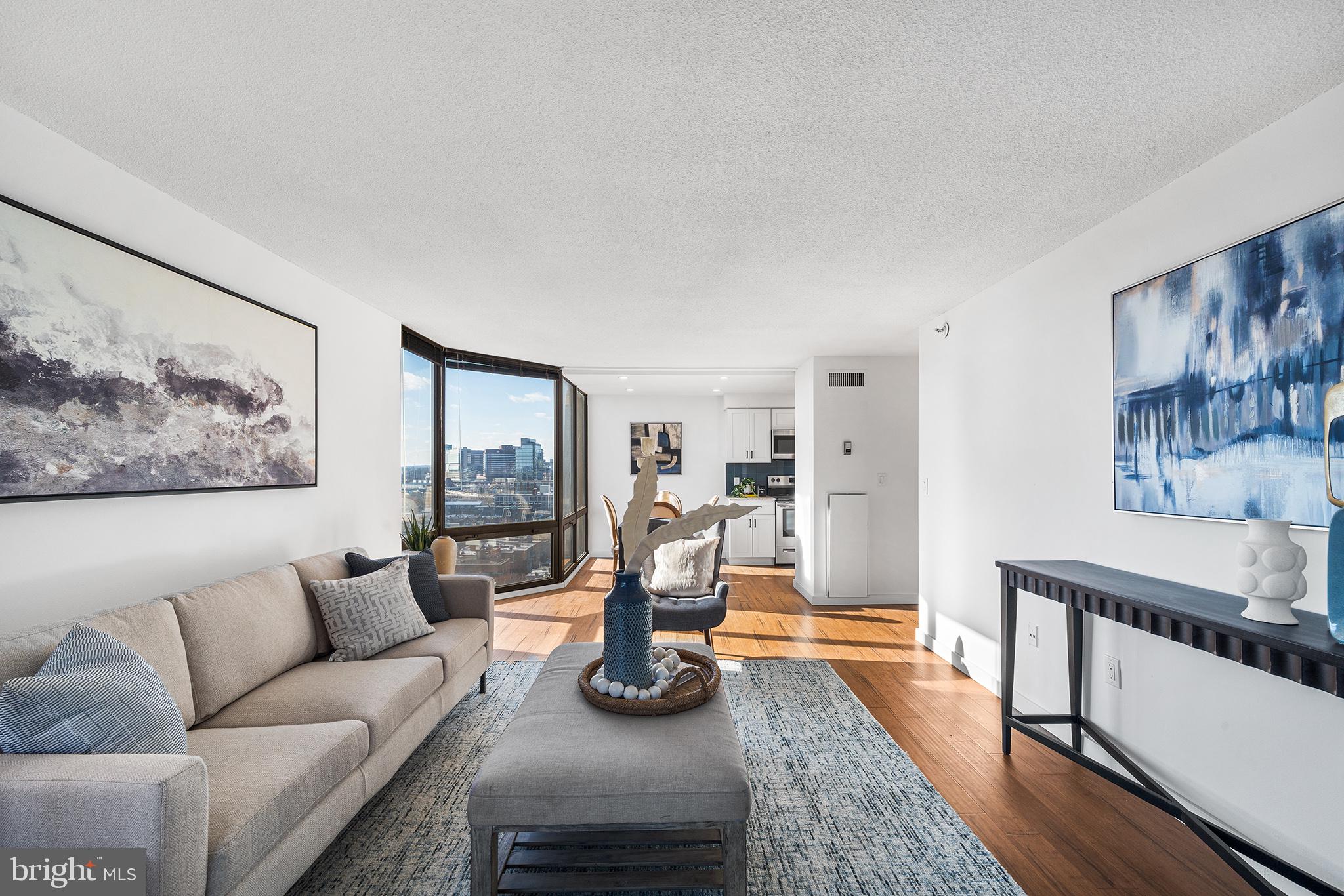 2018 Walnut Street, Unit 16E Philadelphia, PA 19103 - Photo 7 of 35 a living room with furniture and a fireplace