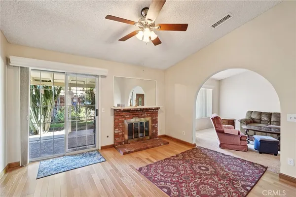 a living room with furniture and a fireplace
