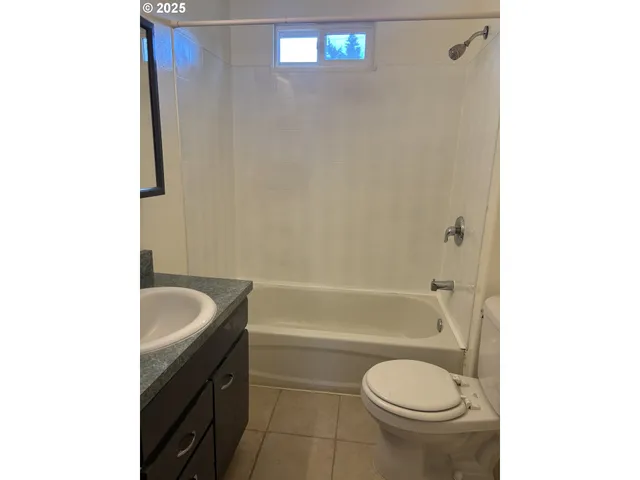 a bathroom with a sink toilet and bathtub
