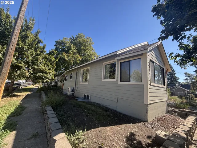 a backyard of a house with lots of green space