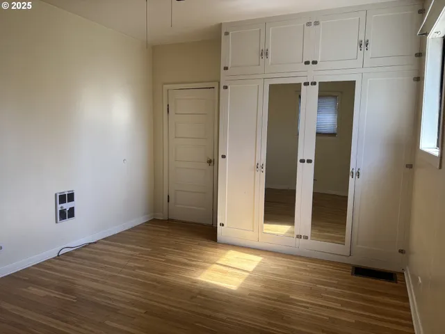 a view of a livingroom with wooden floor