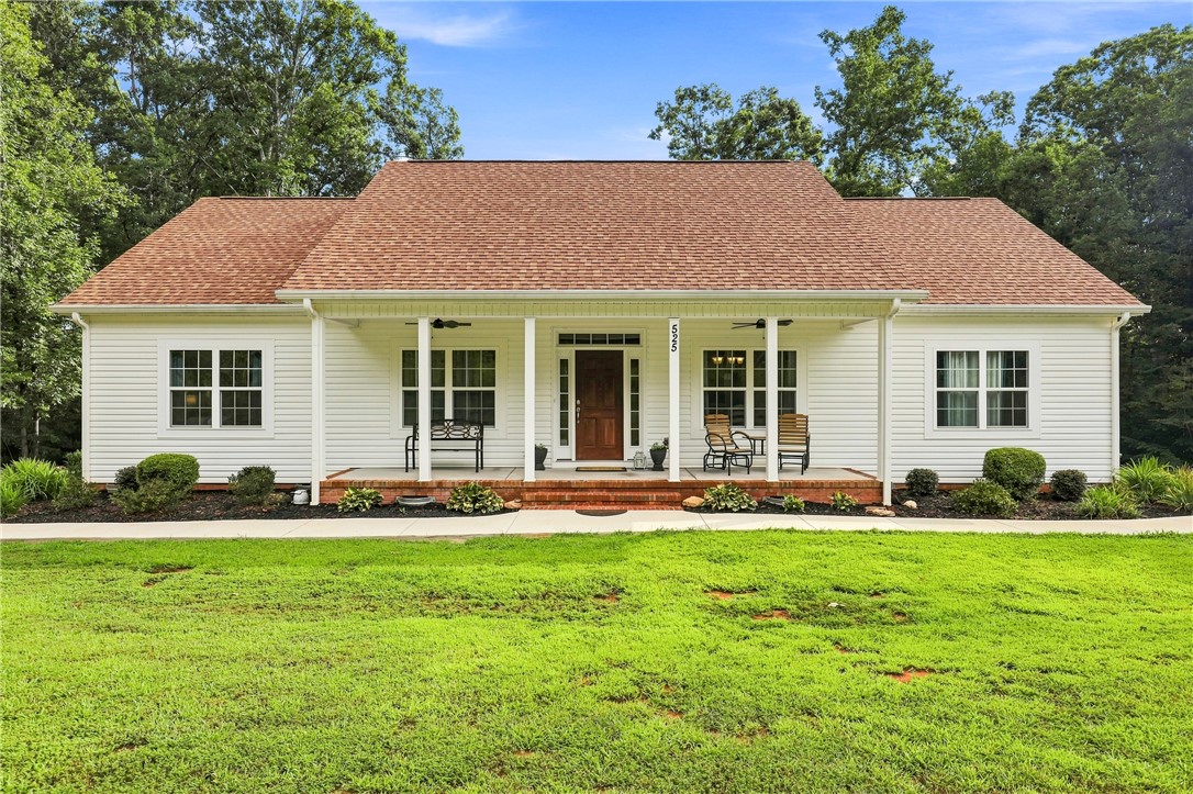 525 Shirley Store Road Anderson, SC 29621 - Photo 1 of 46 An inviting front porch stretches across the exterior of this classic single-story home.