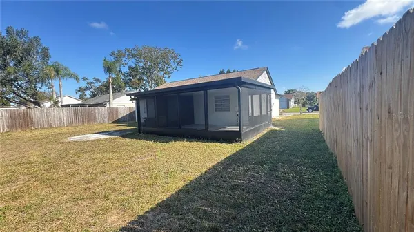 a house view with a backyard space