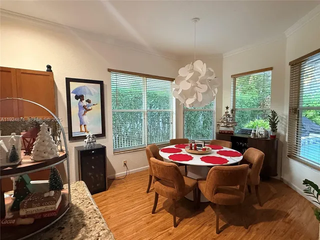 a dining room with furniture and window