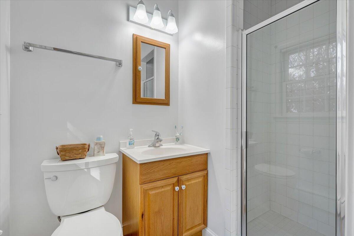 709 Olney Road Vinton, VA 24179 - Photo 15 of 41 a bathroom with a toilet sink and mirror