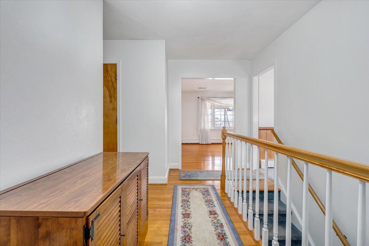 709 Olney Road Vinton, VA 24179 - Photo 2 of 41 a view of a hallway with wooden floor and staircase