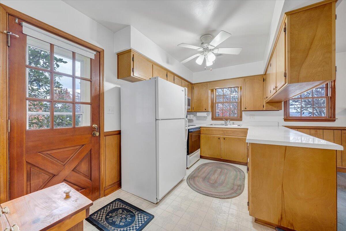 709 Olney Road Vinton, VA 24179 - Photo 6 of 41 a kitchen with a refrigerator a stove top oven a sink and a window