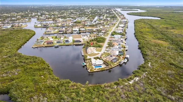 an aerial view of a house with a lake view