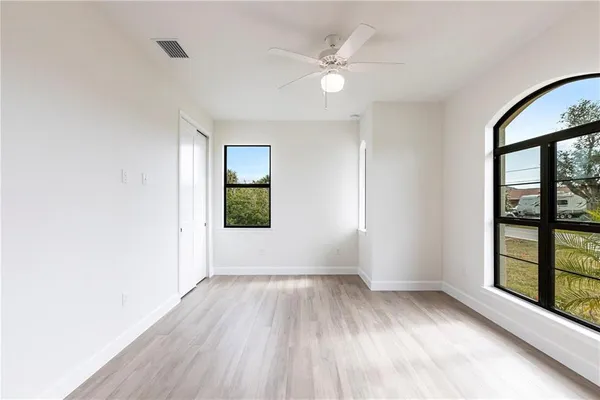 a view of livingroom with hardwood floor and a ceiling fan